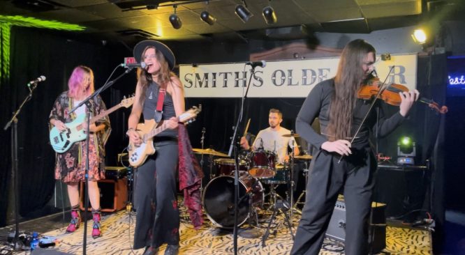 A photo of the band Robin Shakedown on stage at Smith's Olde Bar