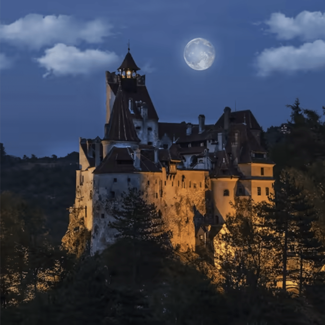 photo of Dracula's castle with a full moon out