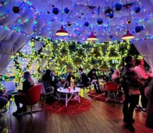 Colony Square in Midtown Atlanta hosts its epic hidden igloo holiday pop-up bar