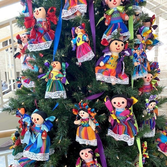 Christmas tree decorated with dolls
