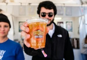Festival goer with beer at SweetWater Festival in Atlanta