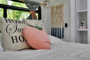 Interiors and bedroom with peach pillow