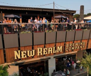 Beloved brewery New Realm Brewing Company's exterior and rooftop on the Atlanta Beltline