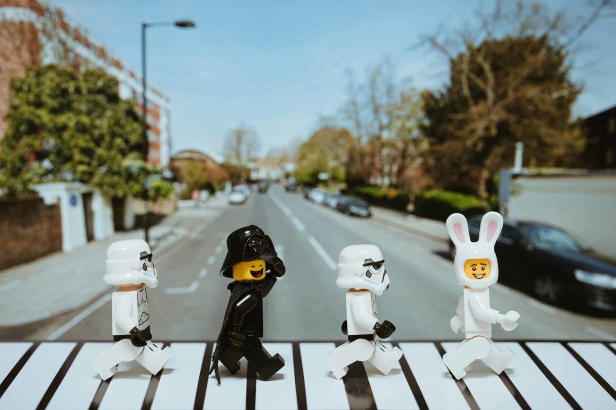 Lego pieces recreating the cover of The Beatles Abbey Road album.