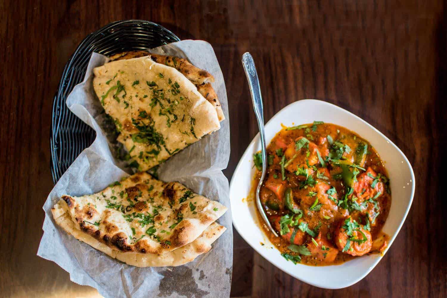 Flatbread and a bowl of curry.