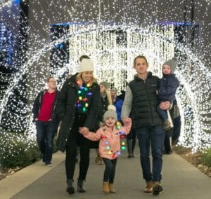 Family enjoying the holiday lights at the Atlanta Botanical Garden