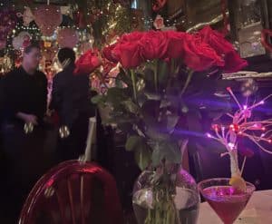 A bouquet of roses in the center of the table at Amore e Amore