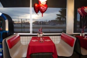 Valentine's Day setup at Waffle House with a heart shaped balloon in the center