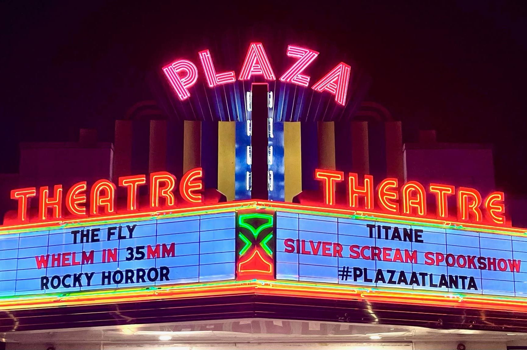 lit up image of the plaza theatre in atlanta