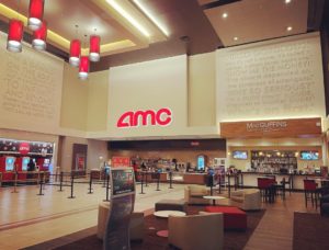 Inside AMC Madison Yards 8, with its grand lounge featuring iconic movie quotes on the wall