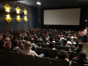 Speaker before a screening inside on of the movie theatres at Atlanta's Landmark Midtown Art Cinema