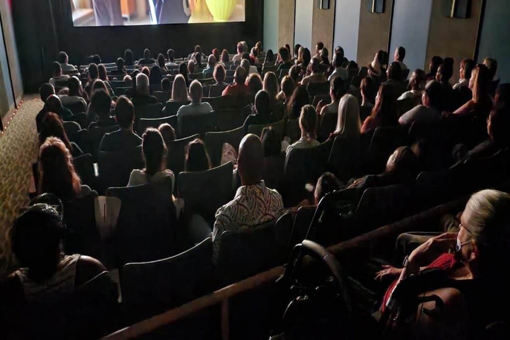 Audience watching a movie screen